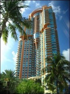 Residential condominium high-rise building with palm trees